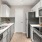 a kitchen with white cabinets