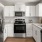 a kitchen with white cabinets
