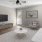 a living room with a tv and couches
