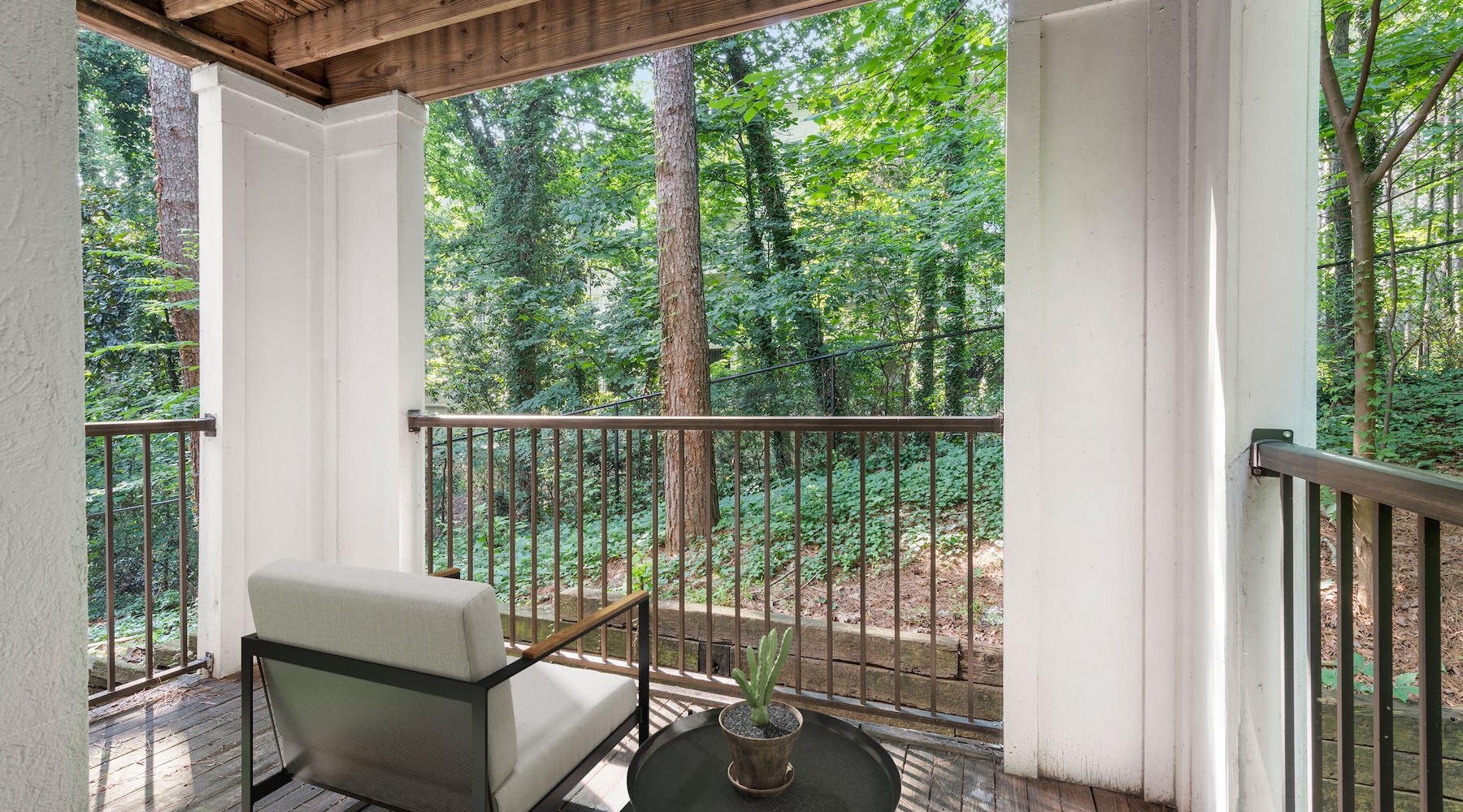 Love where you live patio with seating and view of trees