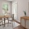 a dining room with a table and chairs