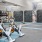 exercise space with spin bikes, weights, and climbing wall