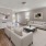 a living room with white furniture
