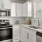 a kitchen with white cabinets