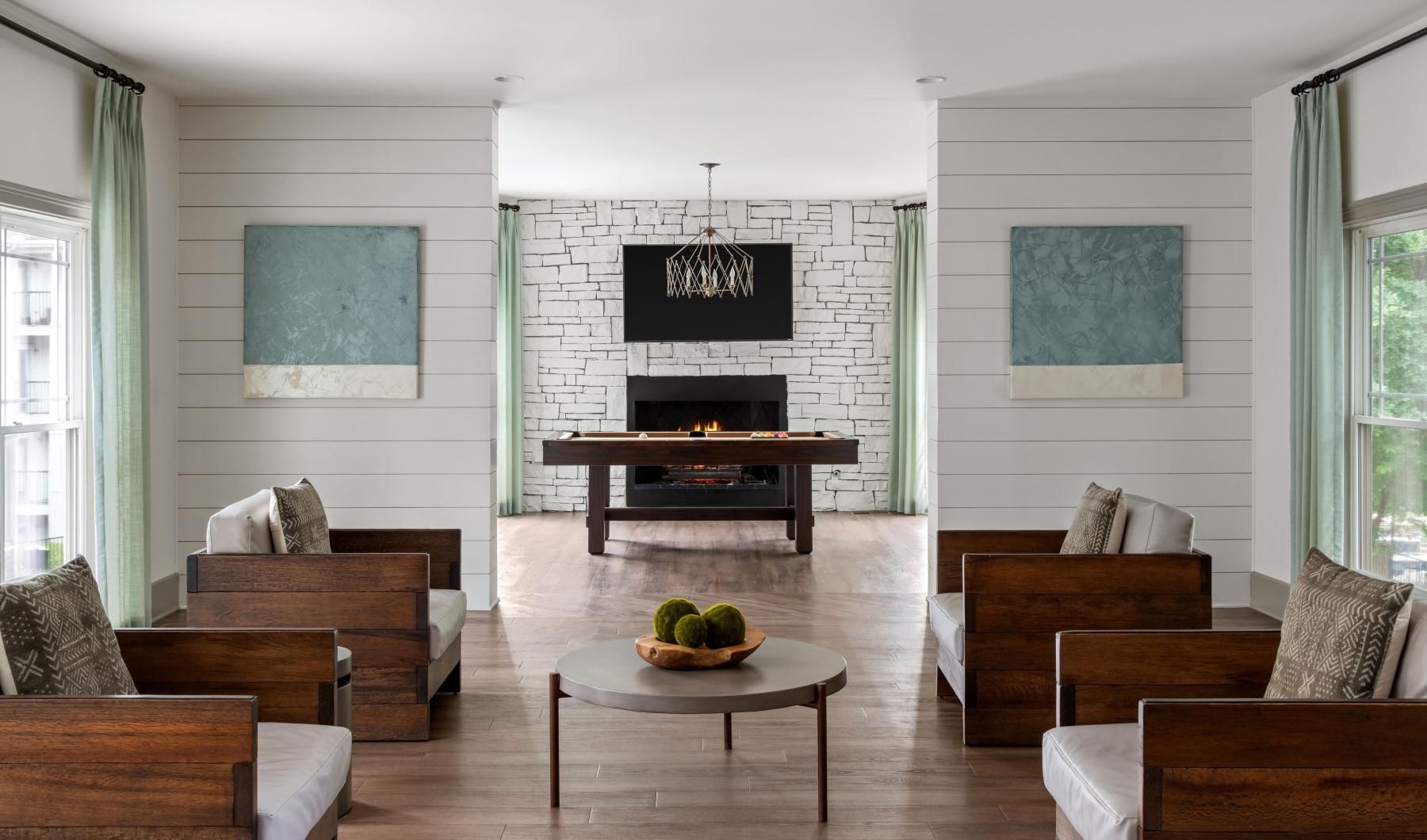 Settle into comfort at Sirona clubhouse seating area with fireplace